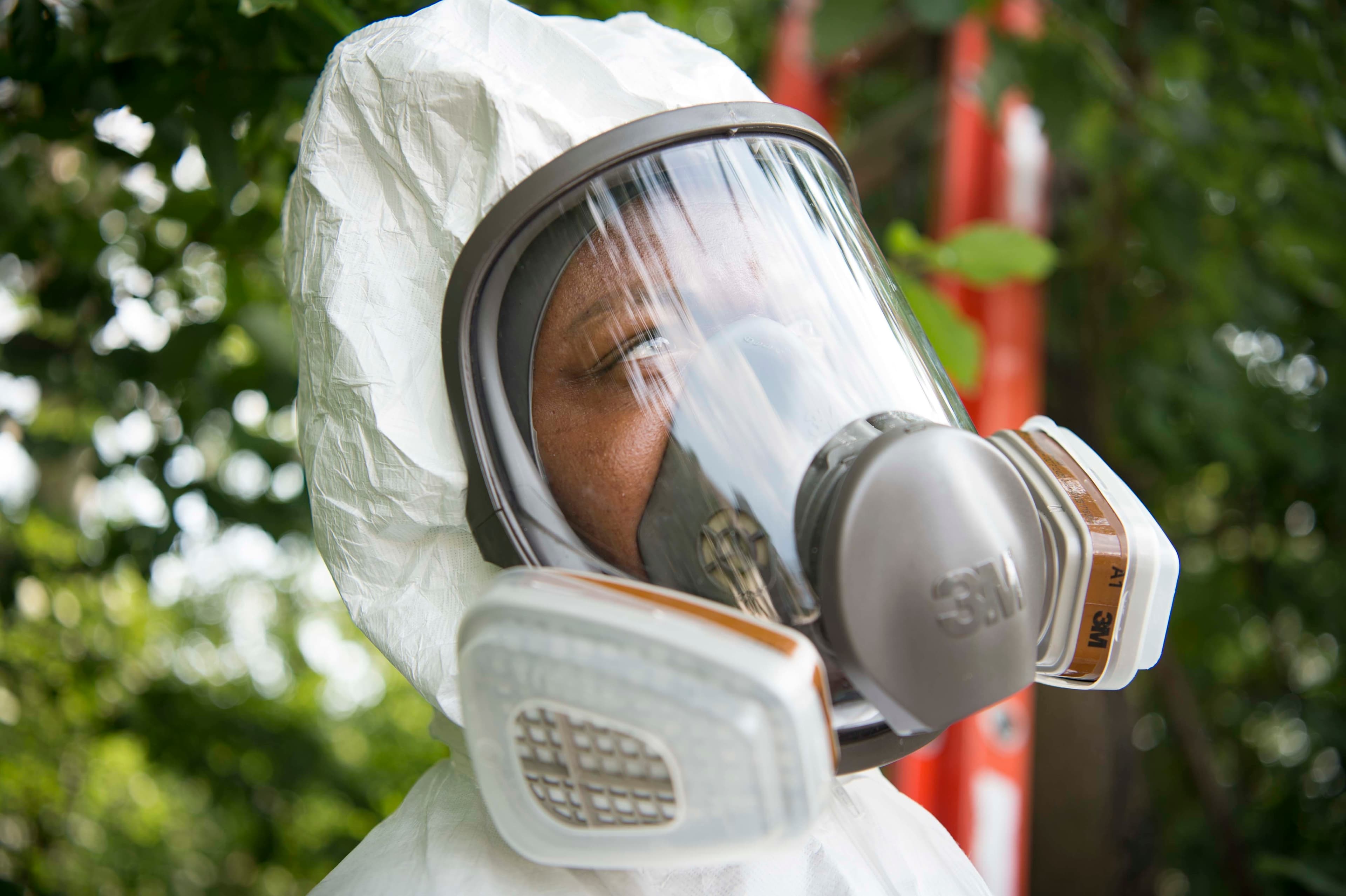 Pest control service at a residential home exterior
